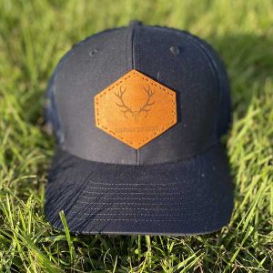 front of navy logo patch hat with leather patch