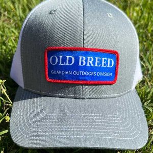 Old Breed Hat gray front with white mesh and blue patch with red trim